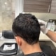 Dr Kelemen teaching the patient how to take care of their freshly transplanted hair and donor area.